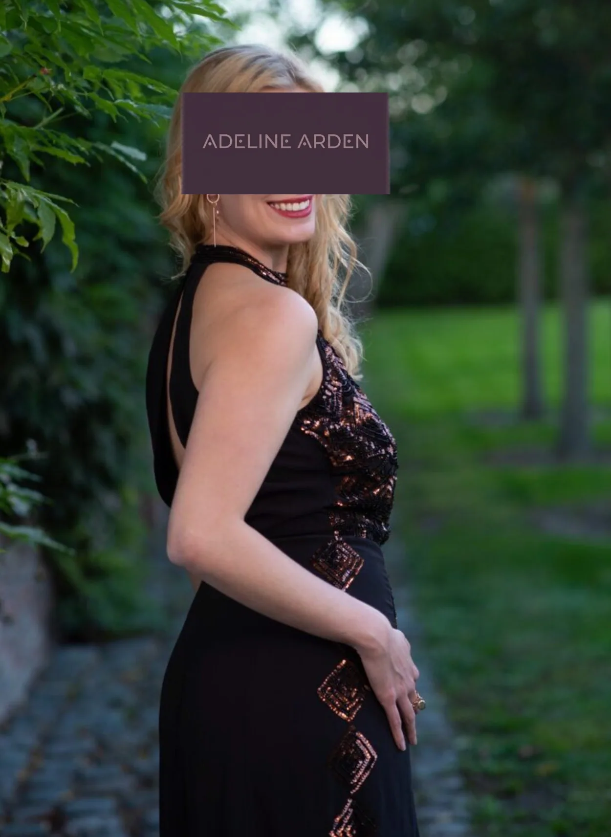Adeline in a black evening dress